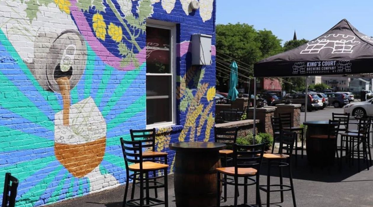 Outdoor seating and mural at brewery