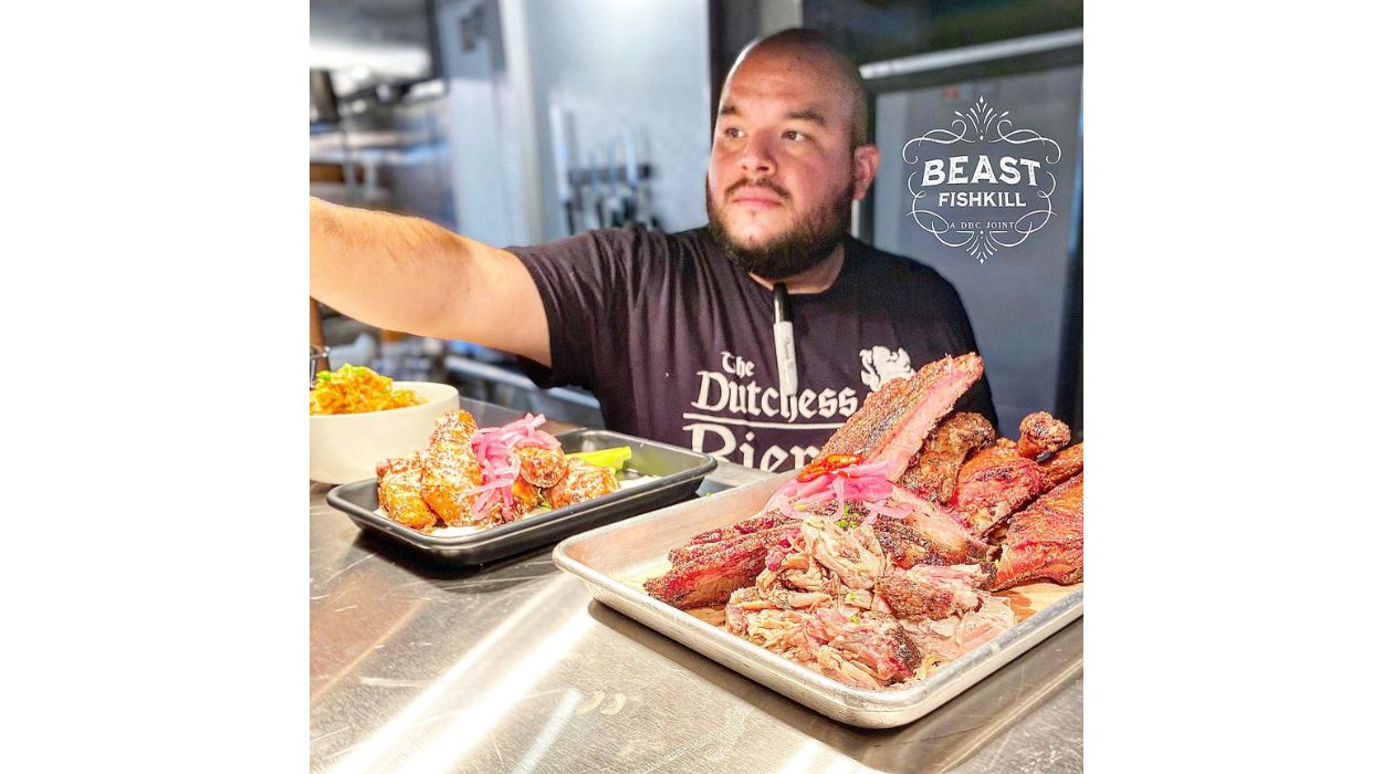 Employee serving barbecue at Beast in Fishkill