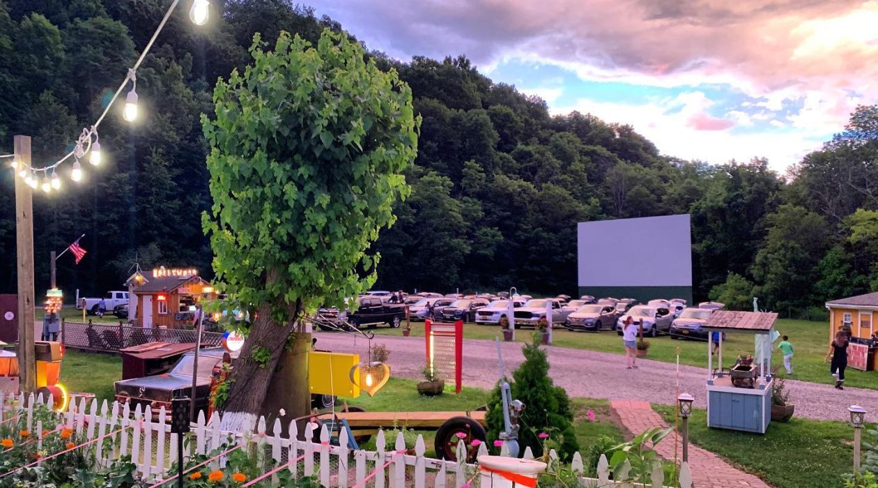 Drive in theater screen against a vibrant sunset