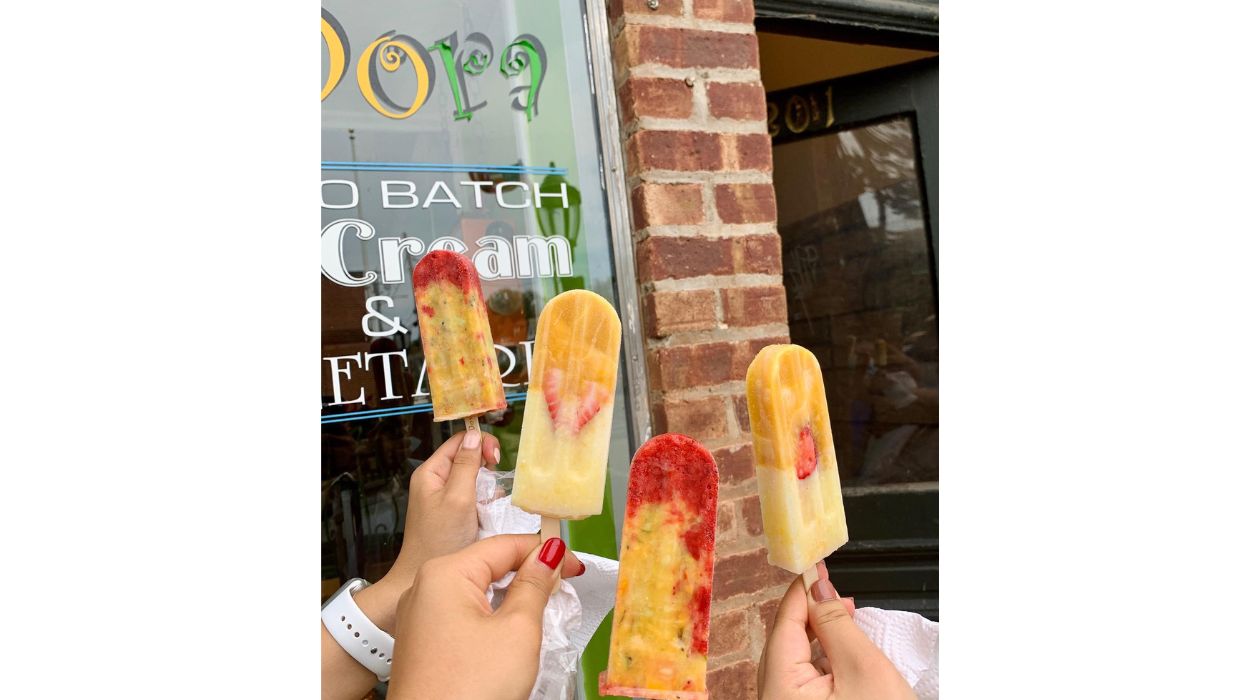Group of friends hold Zora Dora popsicles
